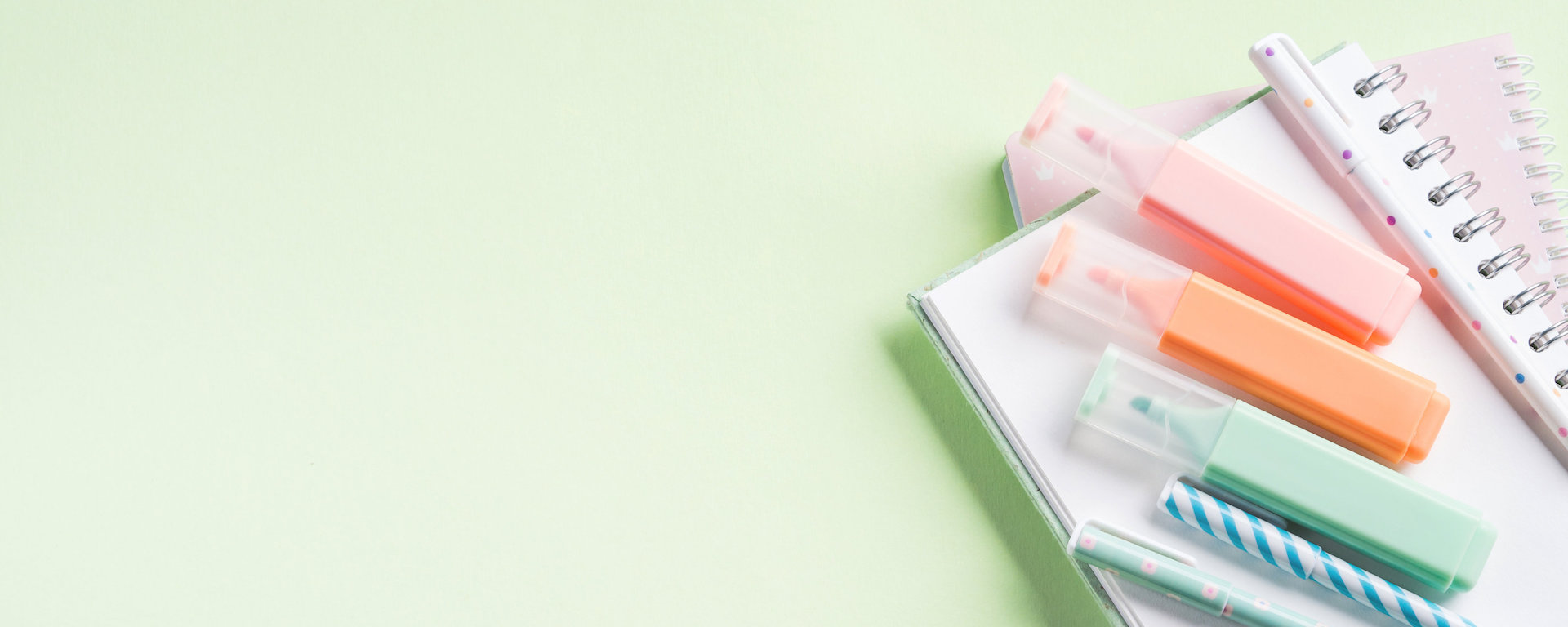 green back to school flat lay with pastel stationery